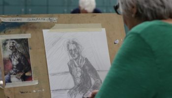 Older woman working on a sketch