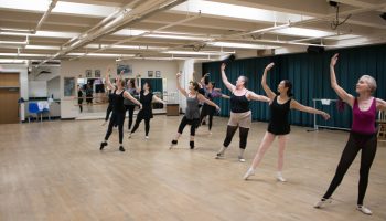 Adults practicing ballet