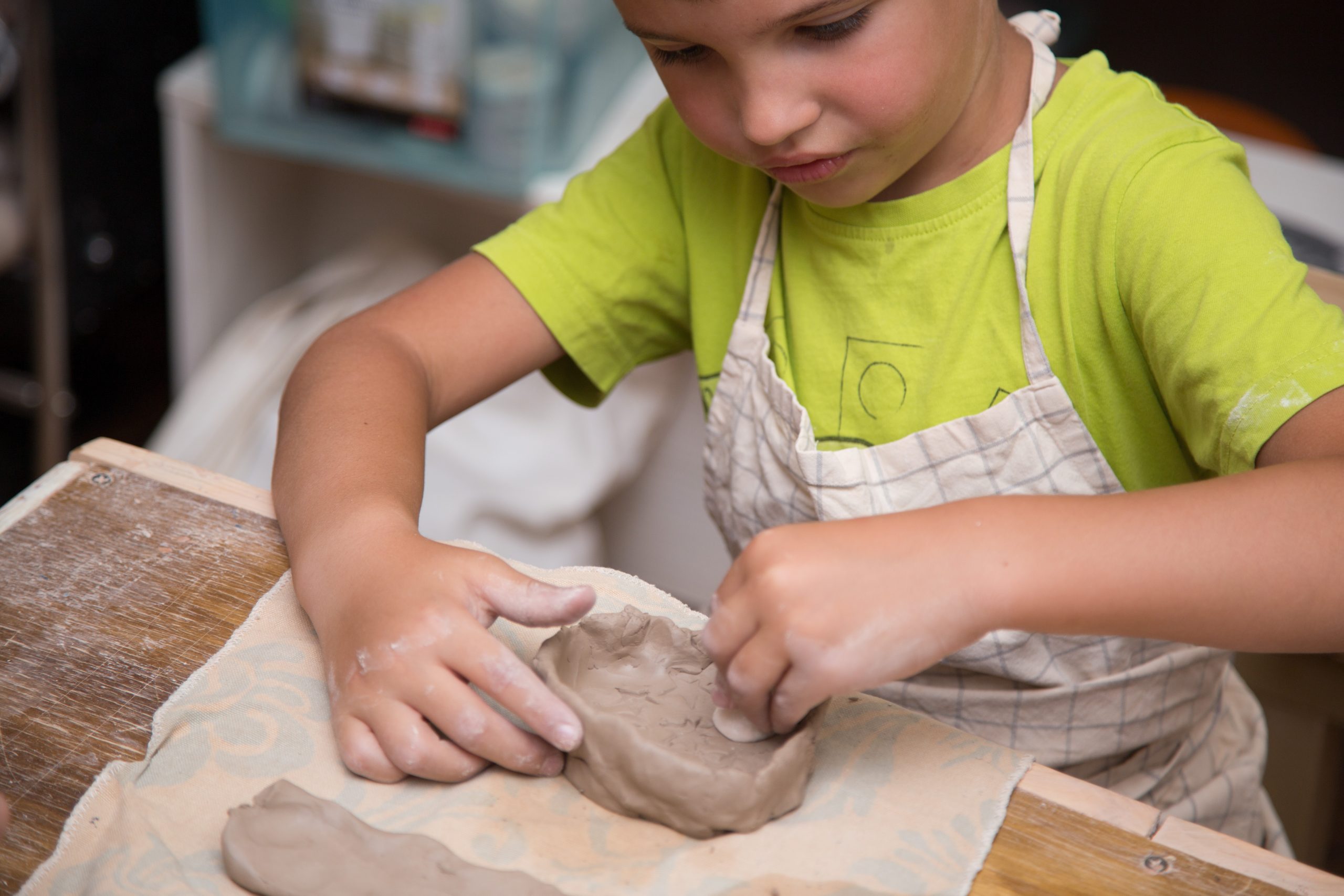 Child working with clay