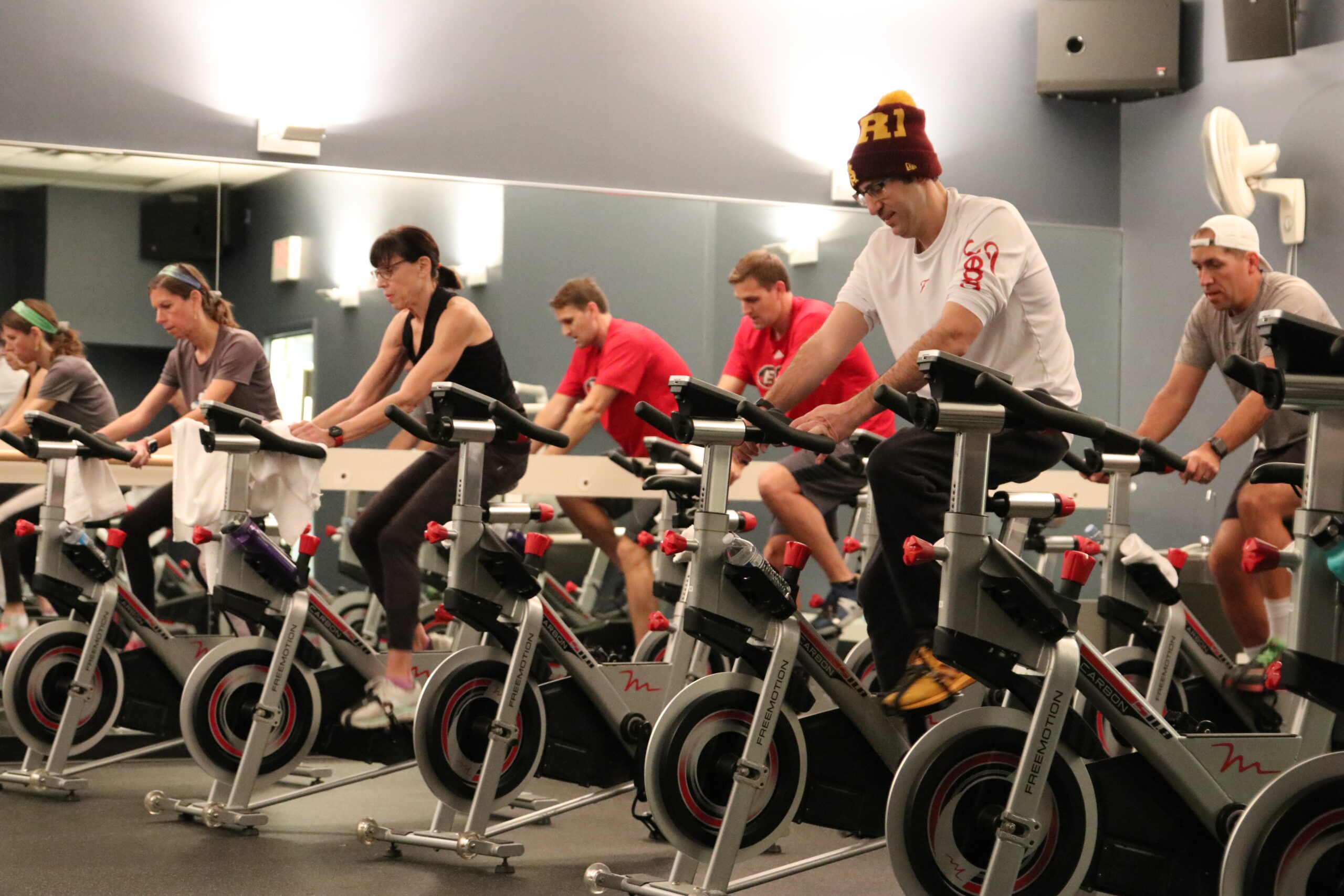 Group of people on exercise bikes